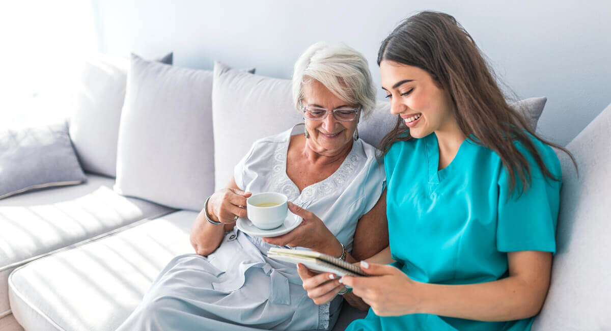 Care assistant providing friendly companionship at home